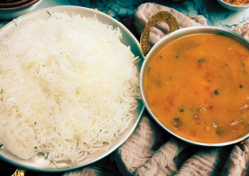 Authentic Nepali daal bhat served with steamed rice, dal, vegetables, and achar.