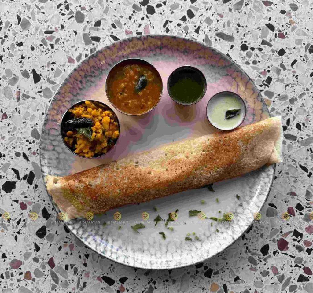 Crispy rolled dosa served with sambar, coconut chutney, and spiced potato filling